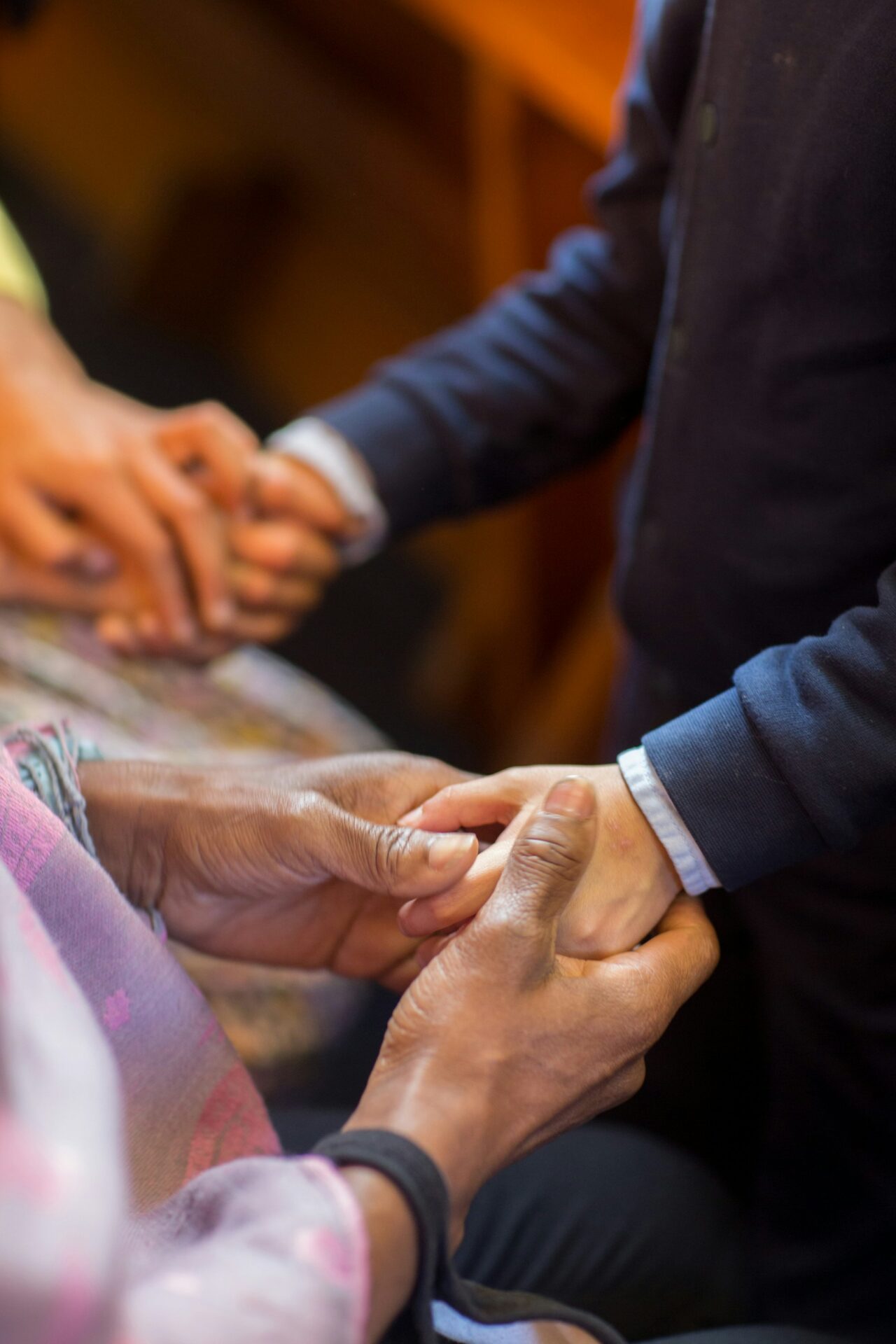 A group of people holding hands.